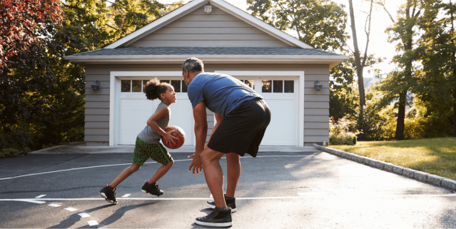 Father and daughter playing basketball